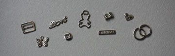 Metalowe guziki, blaszki i ozdoby krawieckie